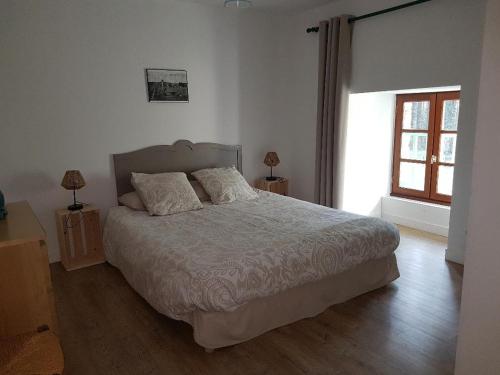 Ένα ή περισσότερα κρεβάτια σε δωμάτιο στο Paimpont: Gîte de la Haute Fenderie