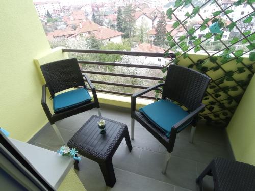 two chairs and a table on a balcony at STAN NA DAN BIJELJINA in Bijeljina