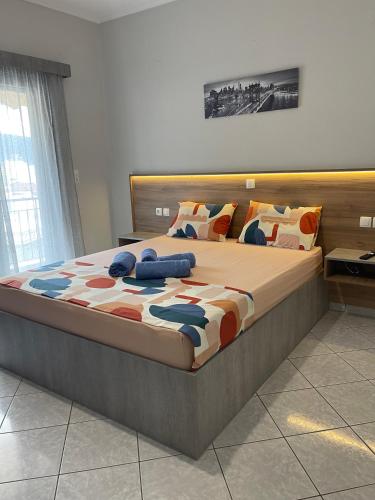 a bedroom with a large bed in a room at Litsa's Apartment in Igoumenitsa