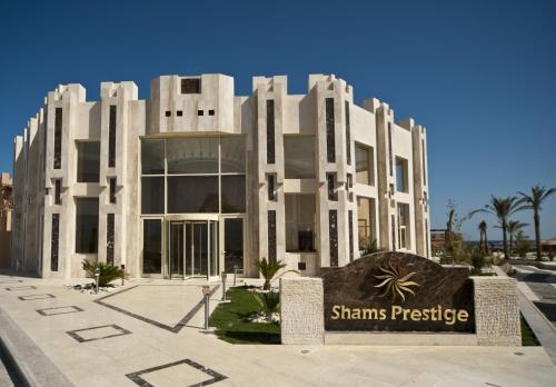 a building with a sign in front of it at Shams Prestige Abu Soma (Adults Only) in Hurghada