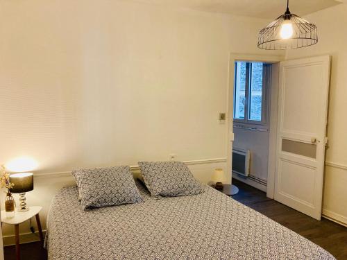 Postel nebo postele na pokoji v ubytování Les Bains Appartement proche de la Mer