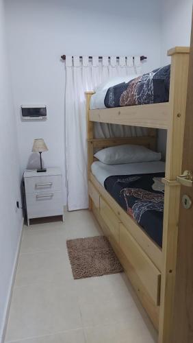 Voodi või voodid majutusasutuse FRALU alojamiento toas