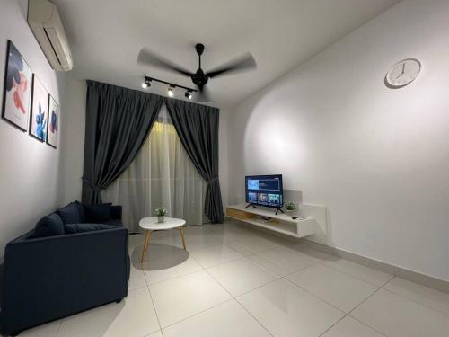 a living room with a couch and a ceiling fan at Teega Suites #3101 Puteri Harbour Iskandar Puteri in Nusajaya