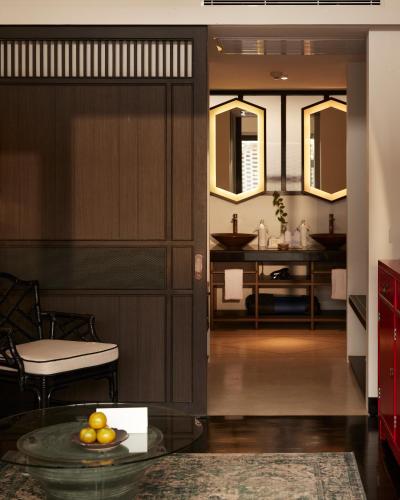 a hallway with a living room and a dining room at Aleenta Retreat Chiang Mai - The Leading Hotels of the World in Chiang Mai