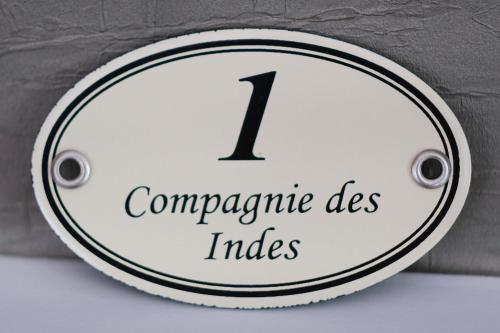 a white clock with the number on it at Château de Crespy & Suites in Crespy-le-Neuf