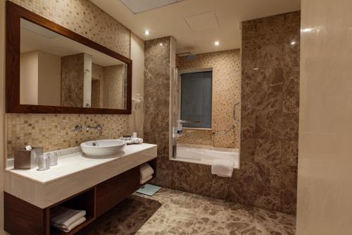  Elite Byblos Hotel -  Room  picture :   Minibar    Shower    Bath                           