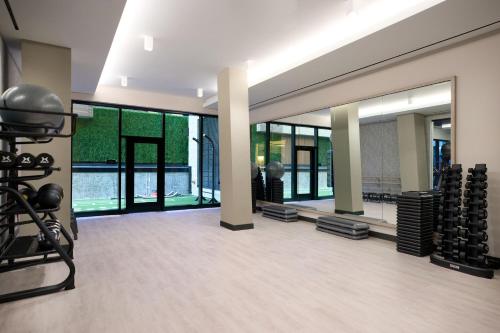 a gym with large windows and a large mirror at Washington Marriott Capitol Hill in Washington