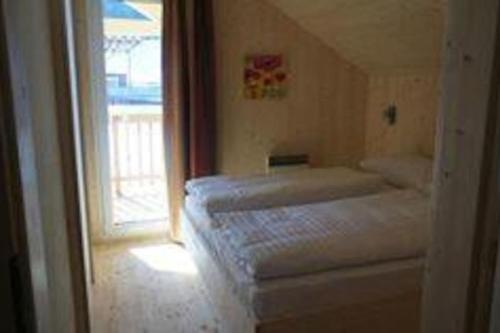 a bedroom with two beds and a window at Chalet Murau: Luxurious 5 star chalet in ski area Kreischberg in Murau