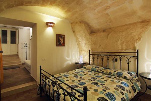 Postel nebo postele na pokoji v ubytování Stay Matera nei Sassi