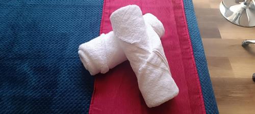 a pair of white socks sitting on a bed at Nuevo Loft completo 34 Corferias Movistar Arena Campin HOST-MI in Bogotá