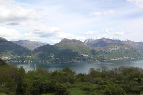 a view of a lake with mountains in the background at Hotel Ristorante La Sorgente in Plesio