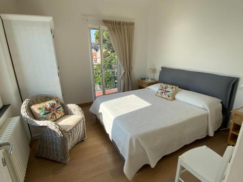A bed or beds in a room at Attico Fronte Mare nel Borgo di Celle Ligure