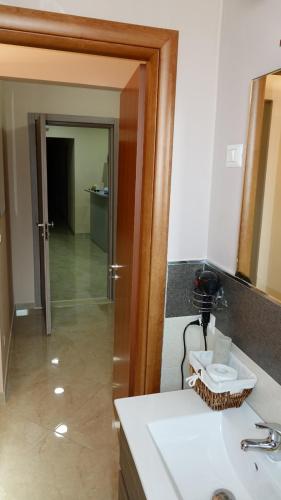 a bathroom with a sink and a mirror at Cairoli Exclusive Rooms & Suite in Brindisi