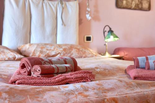 Letto o letti in una camera di B&B Adelche