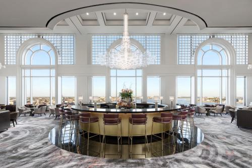 a large room with a chandelier and a round table at The Westin New Orleans in New Orleans