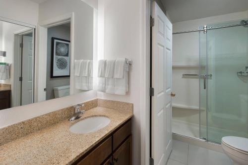 a bathroom with a sink and a shower at Residence Inn Silver Spring in Silver Spring