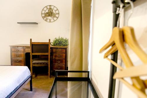 Una cama o camas en una habitación de MyWay Colosseo Apartment