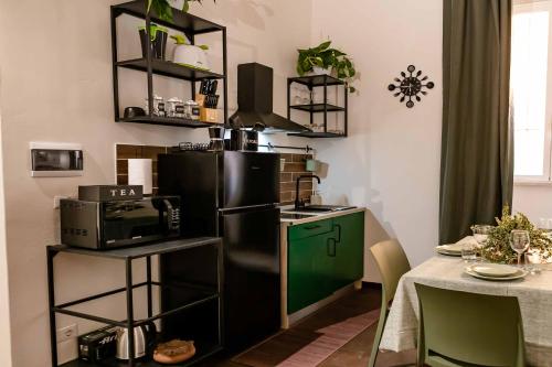 Una cocina o kitchenette en MyWay Colosseo Apartment