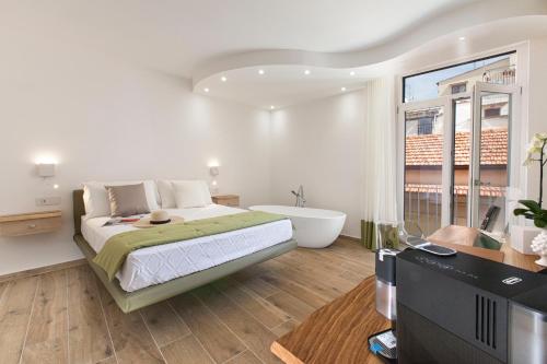 מיטה או מיטות בחדר ב-YourHome - Lidia Rooms & Suites
