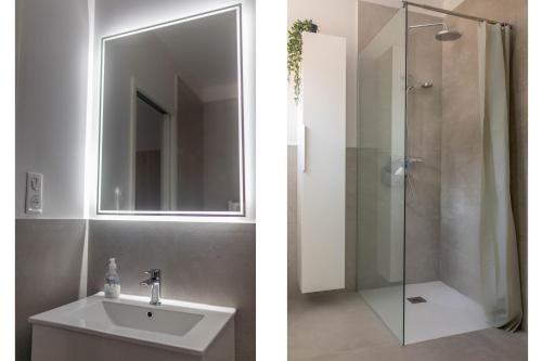 a bathroom with a sink and a shower with a mirror at CHAMBRE DELUXE 2 vue Mer Jacuzzi in Ajaccio