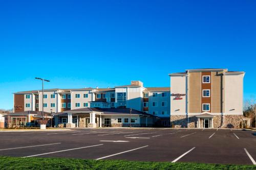 an empty parking lot in front of a building at Residence Inn by Marriott Bath Brunswick Area in Bath