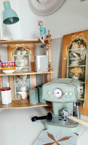 a kitchen with a stove on a shelf at Interno 15 Diario di viaggio in Vigevano