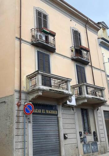 a building with two doors and two balconies on it at Interno 15 Diario di viaggio in Vigevano