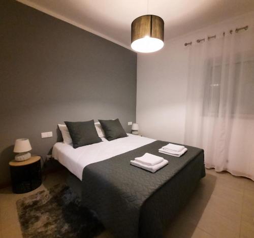 Ένα ή περισσότερα κρεβάτια σε δωμάτιο στο Vila Nova House