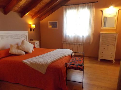 Postel nebo postele na pokoji v ubytování Hostal El Recanto