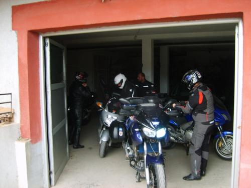a group of motorcycles parked in a garage at Smeštaj - sobe MARVEL in Niš