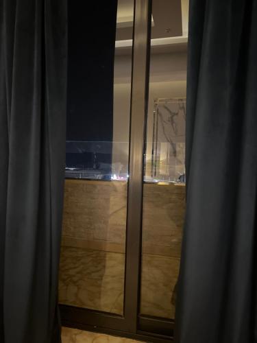 a sliding glass door with a view of a room at Pyramids top success result in Cairo