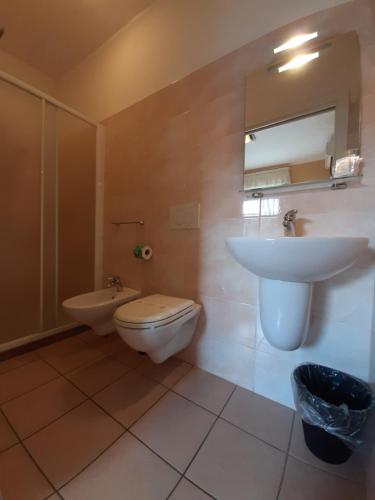 a bathroom with a sink and a toilet at Hotel Originale by ALEhotels in Rimini