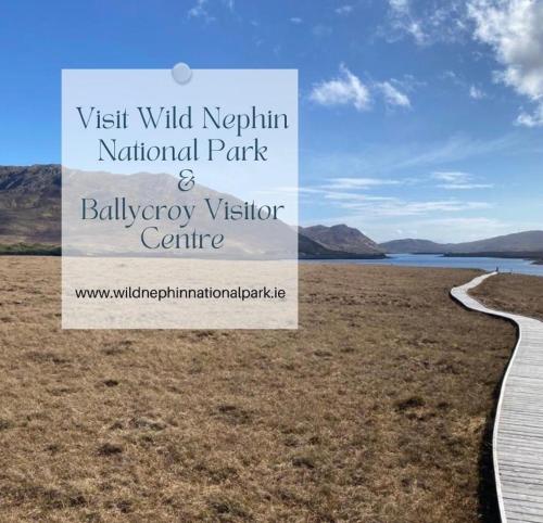 a park with a sign in the middle of a field at Seascape on the edge of town: 4 beds all ensuite. in Belmullet