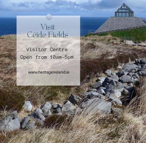 a sign for a visitor center on the side of a cliff at Seascape on the edge of town: 4 beds all ensuite. in Belmullet