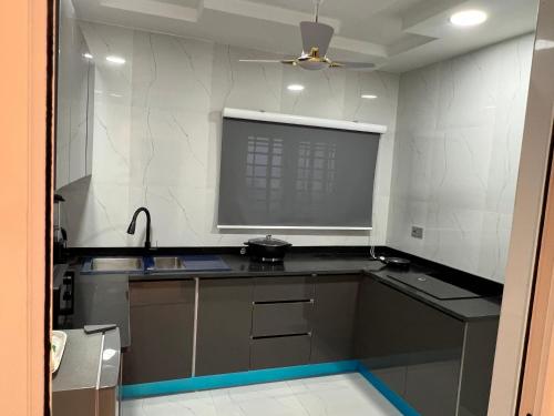 a kitchen with a sink and a counter top at HMS SEA VIEW VILLA in Accra