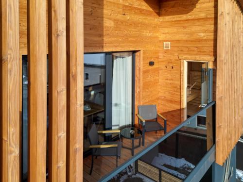 a view of the living room from the balcony of a house at zeitlang by Rösslwirt in Lam