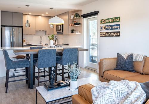 a kitchen and living room with a table and chairs at The Big Deck by Revelstoke Vacations in Revelstoke