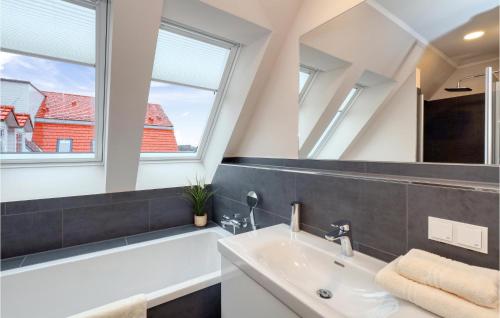 a bathroom with a sink and a mirror at Baltischer Hof Apartment 57 in Boltenhagen