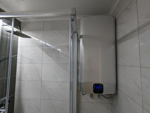 a shower stall in a bathroom with a shower at VilaFplaza by JohnVillas in Portimão