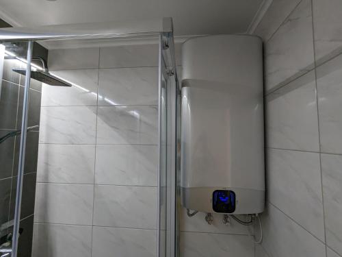 a shower stall in a bathroom with a shower at VilaFplaza by JohnVillas in Portimão