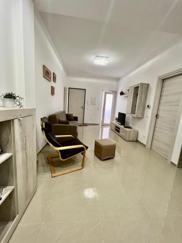 a living room with a couch and a chair at Casa Lollo in Chiavari