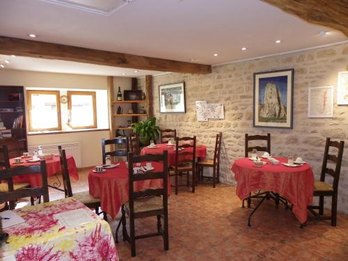 En restaurant eller et andet spisested på Le Cottage du Château