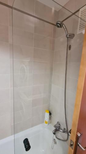 a shower in a bathroom with a sink at Apartment Punta Umbría Luxury in Punta Umbría