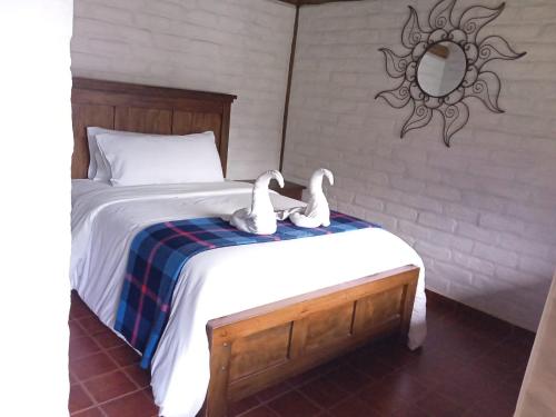 Giường trong phòng chung tại En Casa de Luis