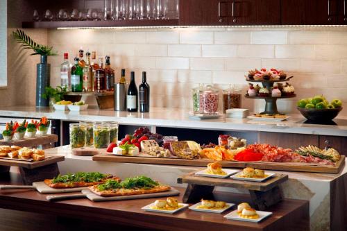 a buffet line with many different types of food at Atlanta Airport Marriott Gateway in Atlanta