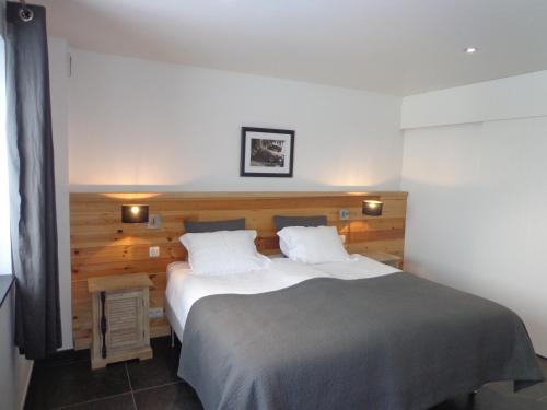 Postel nebo postele na pokoji v ubytování B&B Domaine du Vieux Chêne