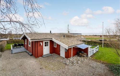 a red house with a white door at Amazing Home In Haderslev With Wifi in Haderslev