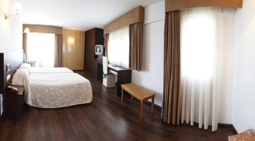 Ένα ή περισσότερα κρεβάτια σε δωμάτιο στο Hotel Park