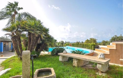 a swimming pool with a bench and palm trees at Beautiful Home In Pozzallo Rg in Pozzallo