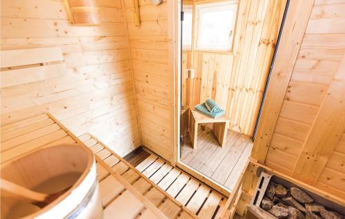 an inside view of a wooden cabin with a toilet at Ferienhaus 6 Altefhr in Altefähr